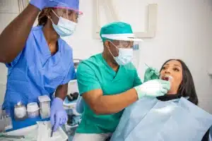 Dentist checks a patient's teeth