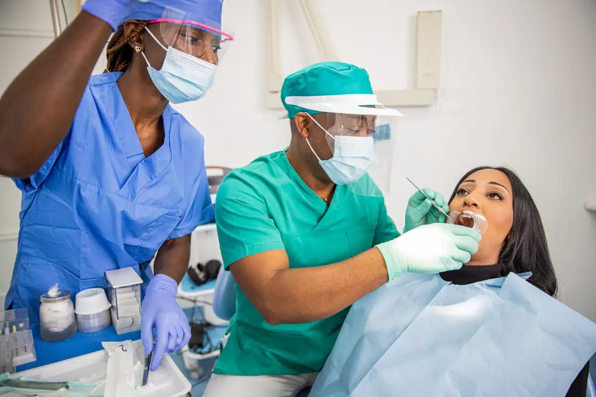 Dentist checks a patient's teeth