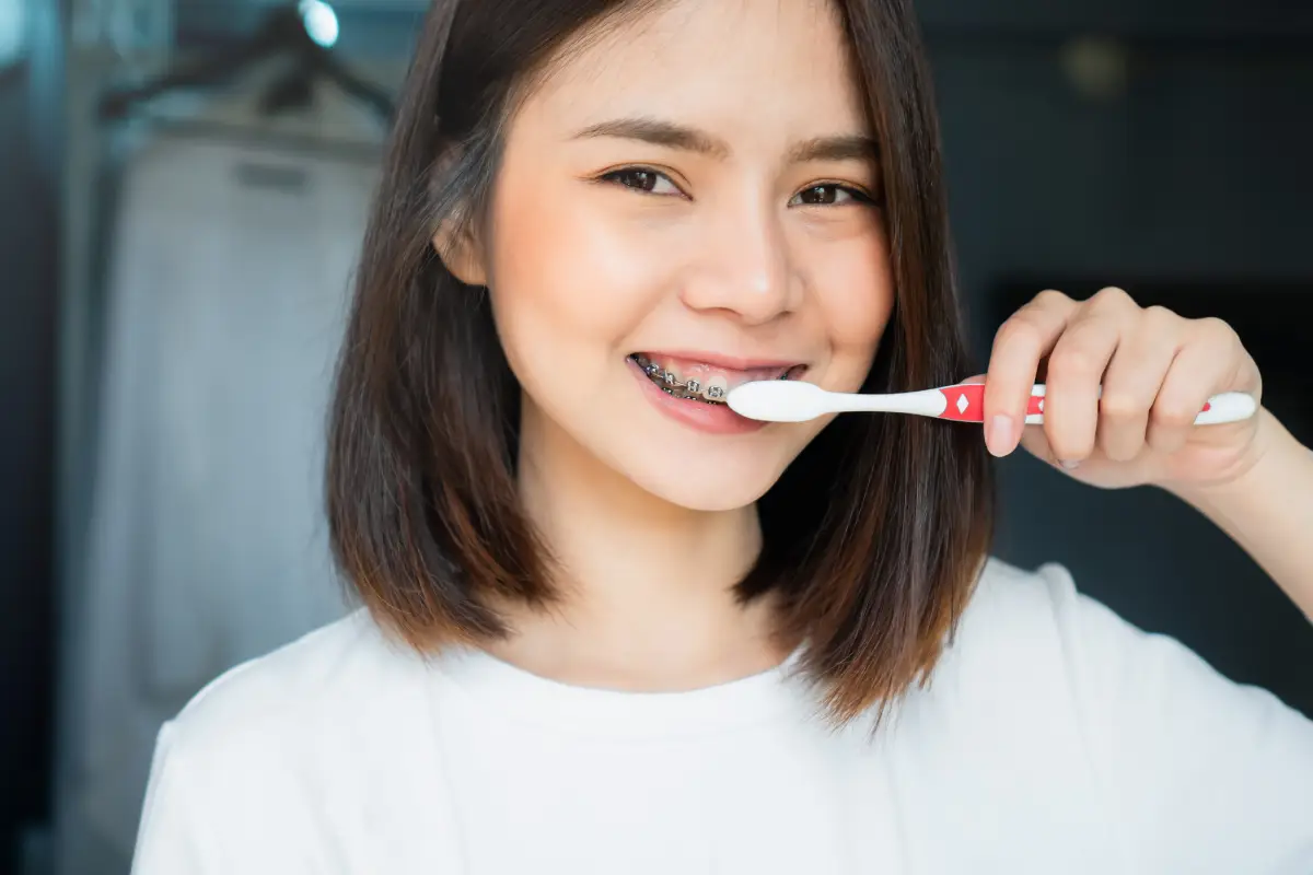Woman brushing teeth